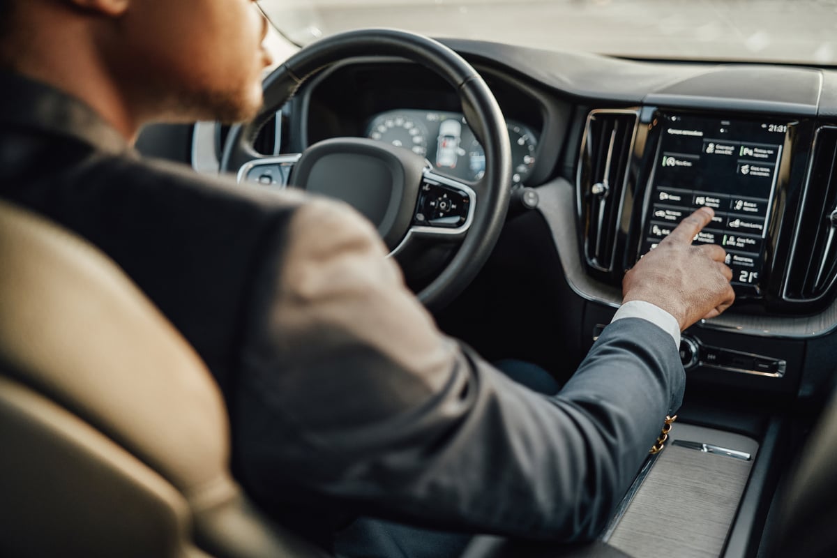 Car Driver Operating the Dashboard